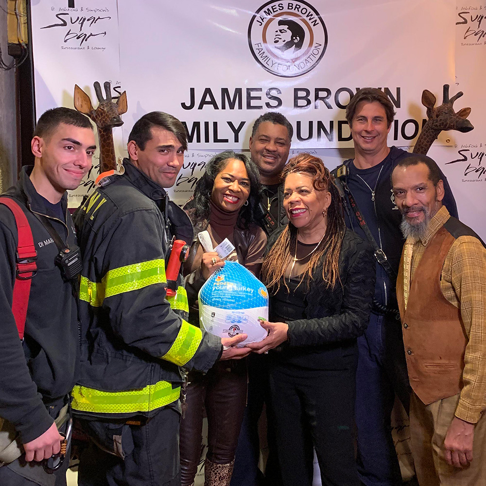 Pictured with Mrs. Deanna Brown is Ms. Valerie Simpson, Firefighters of NYFD and actor Ralph Carter from the hit TV show “Good Times.”